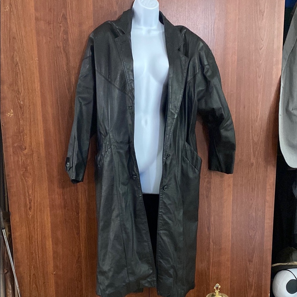 Woman’s Black Leather trench Coat small.  Missing one button